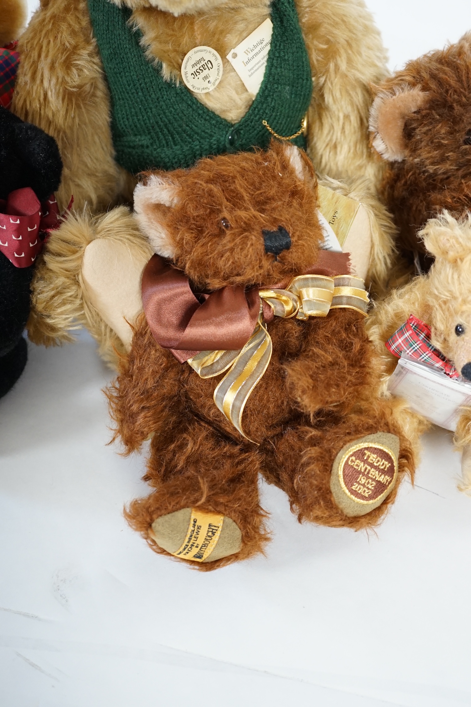 A large 1906 Steiff orange label, two Merrythought John Lewis bears, a black Merrythought bear, an artist bear and a Merrythought Alfred bear (6)